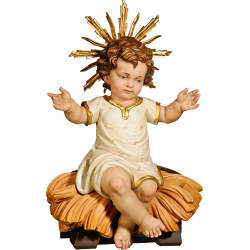 Niño Jesús vestido sentado en cuna